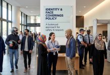 NSW Government Clarifies Policy on Identity and Face Coverings People in a public building setting with face coverings