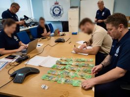 AFP Police NDIS raid $100 Bills found