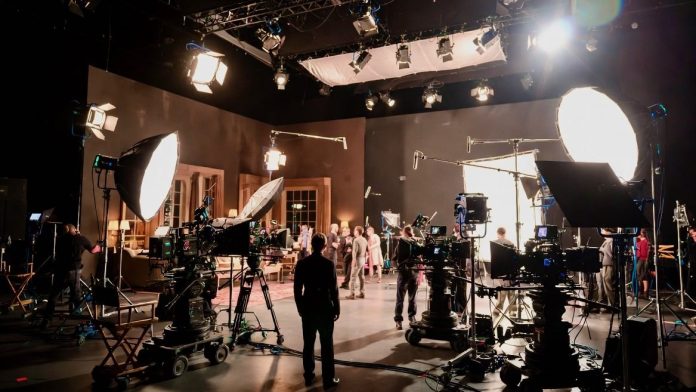 Movie Making Set with Cameras, Lighting, Cast and Crew